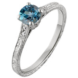 Engraved engagement ring with aquamarine stone and side diamonds. Made in London