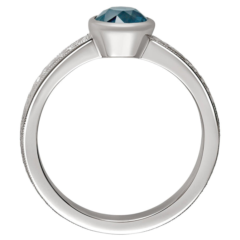 Vintage style engraved ring with teal sapphire. Made in London.