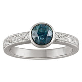 Paisley hand engraved with teal sapphire engagement ring. Made in the UK.