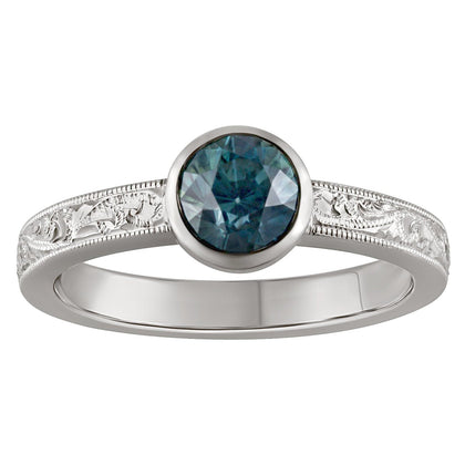 Paisley hand engraved with teal sapphire engagement ring. Made in the UK.