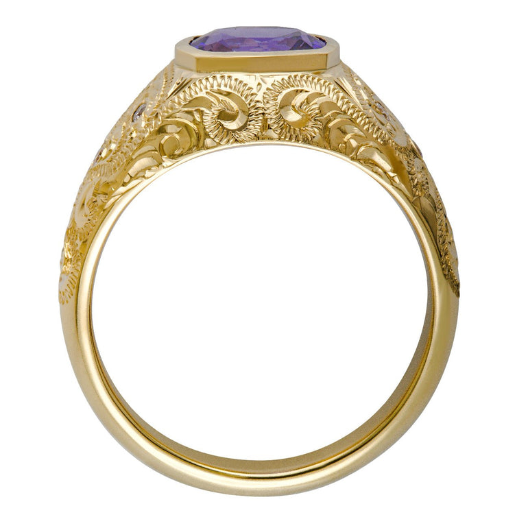 Gold ring with purple gemstone on a white background