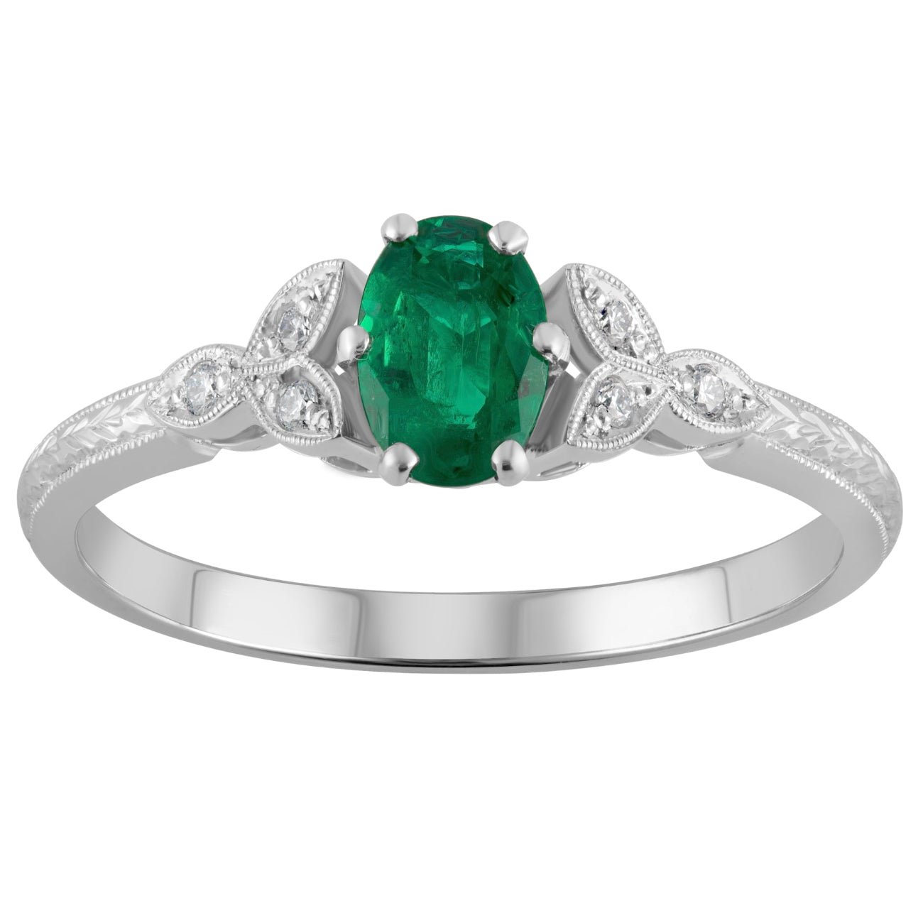 Emerald oval centre stone engagement ring with diamond detailing in platinum made in London UK