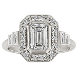Emerald cut diamond halo engagement ring with baguette side diamonds in platinum. Made in London