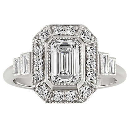 Emerald cut diamond halo engagement ring with baguette side diamonds in platinum. Made in London