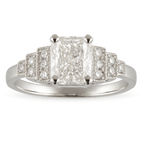 Diamond ring with a central gemstone and smaller diamonds on a white background