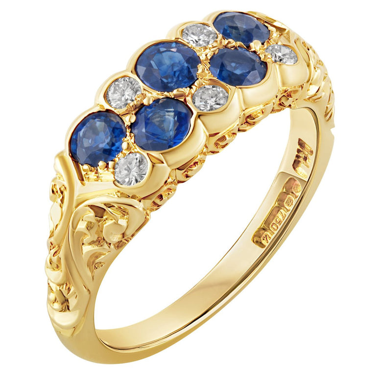 Yellow gold sapphire and diamond ring with engraved shoulders. Made in Hatton Garden