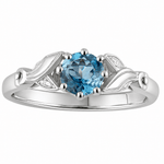 vintage style aquamarine engagement ring with flower shoulders. Made in the UK
