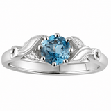 vintage style aquamarine engagement ring with flower shoulders. Made in the UK
