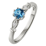round aquamarine engagement ring in platinum. Made in London, Hatton Garden