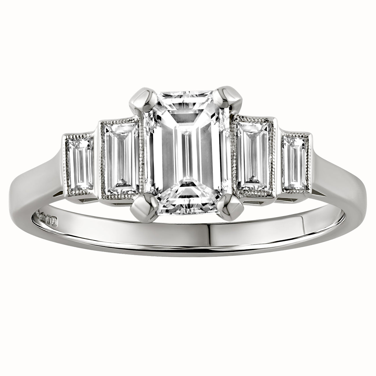 Emerald cut diamond engagement ring with baguette side stones in a stepped design, crafted in white metal, made in London, UK 
