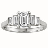 Emerald cut diamond engagement ring with baguette side stones in a stepped design, crafted in white metal, made in London, UK 