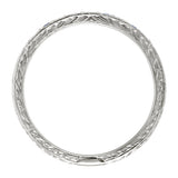 Hand engraved wedding ring with laurel pattern in platinum. Made in the UK.