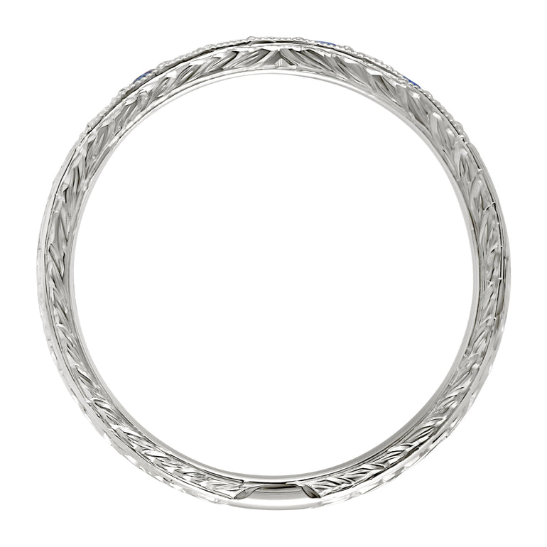Hand engraved wedding ring with laurel pattern in platinum. Made in the UK.