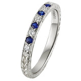 Blue Sapphire and diamond wedding ring with flower pattern. Made in london.