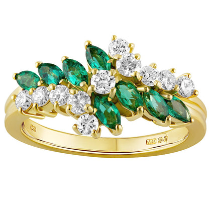 Marquise-cut emerald and round diamond cluster ring in 18ct yellow gold with a floral design. Made in London