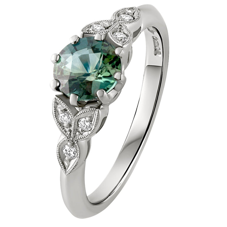 Vintage style Green sapphire engagement ring in platinum with diamond shoulders. Made in London
