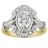 Oval lab grown diamond cluster ring in platinum and 18 carat yellow gold with natural diamond halo. Made in London