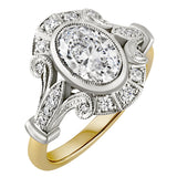 Oval centre lab grown diamond ring surrounded by natural diamonds in platinum and 18 carat yellow gold setting. Made in Hatton Garden