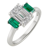 Platinum art deco ring with emerald cut lab grown diamond centre and natural emerald side stones. Made in Hatton Garden.