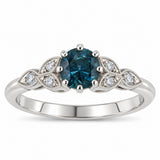 Montana Teal sapphire ring with floral diamond leaves in platinum