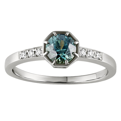 Teal sapphire engagement ring made in London, Hatton Garden, featuring a round cut teal stone with diamond accents on a platinum band.