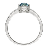 Single stone teal sapphire with diamonds engagement ring made in the UK. 