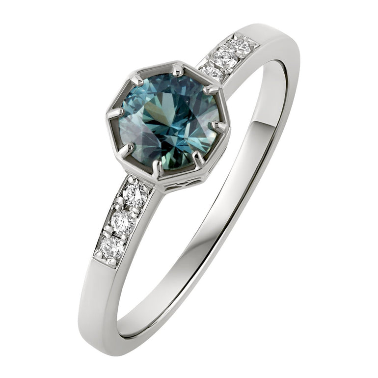 Teal Sapphire engagement ring with diamond shoulders in platinum. Made in the UK