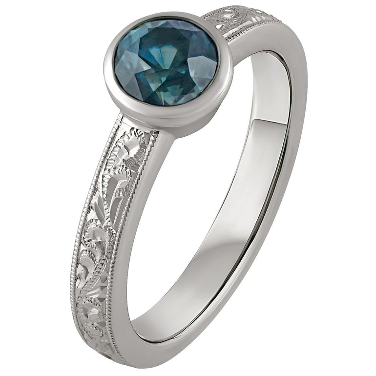 Floral engraved engagement ring with sapphire. Made in Hatton garden.