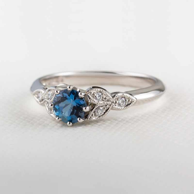 Aquamarine engagement ring with floral design in platinum