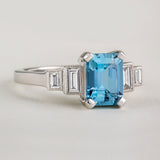 Art Deco aquamarine engagement ring with diamond baguettes in platinum