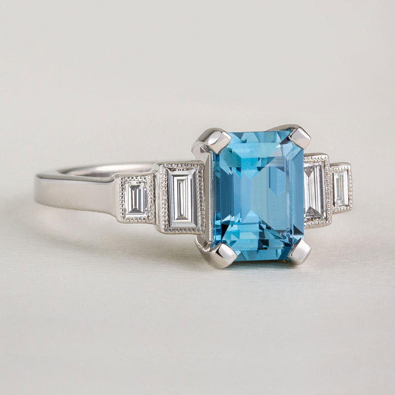 Art Deco aquamarine engagement ring with diamond baguettes in platinum