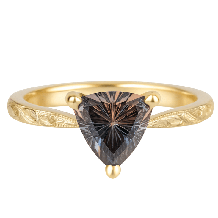 Gold ring with a trillion-cut sapphire diamond on a white background