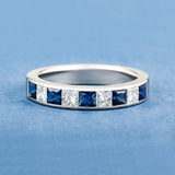 Blue sapphire and diamond half eternity band