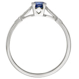 Round blue sapphire in a square setting with diamond shoulders in platinum. Made in London