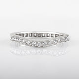 Curved eternity wedding ring in white gold with round diamonds