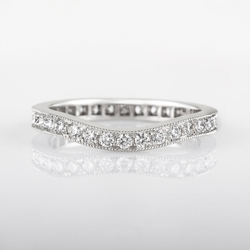Curved round diamond eternity wedding ring in platinum