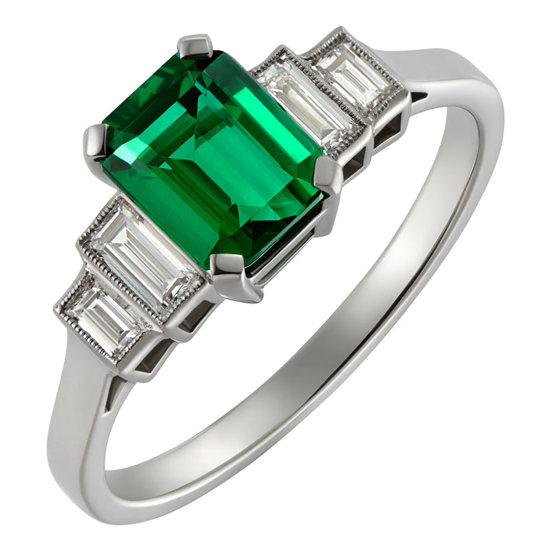 Emerald and diamond engagement ring in platinum vintage style