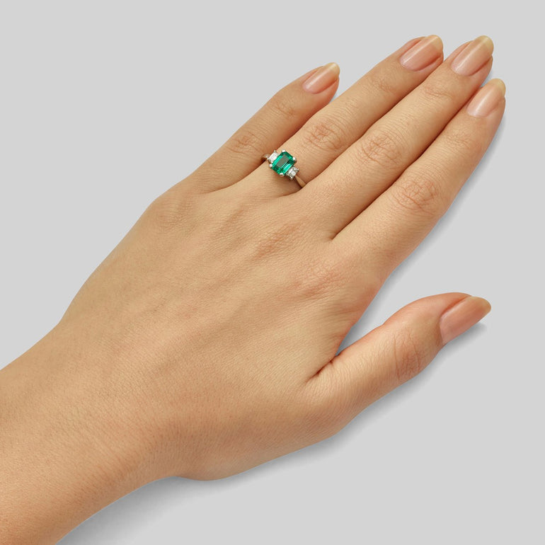Emerald diamond three stone ring