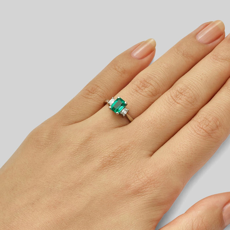 Emerald and diamond trilogy ring in platinum