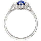 cluster ring with blue sapphire in platinum. made in hatton garden