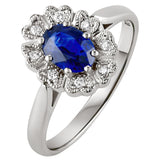 heart shapped cluster ring with blue sapphire in platinum. made in hatton garden