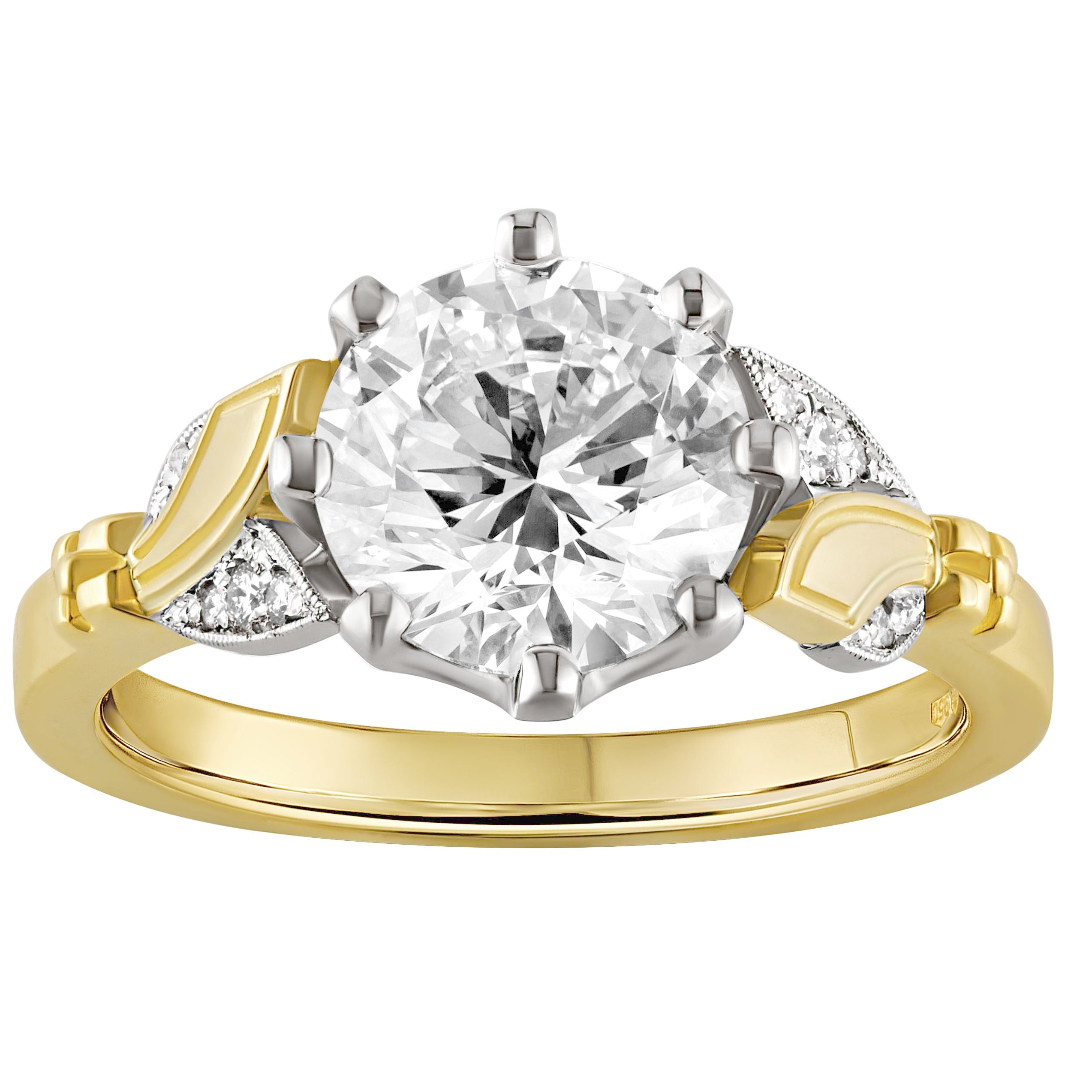 two-tone engagement ring features stunning lab-grown diamonds set on platinum leaves. Made in London