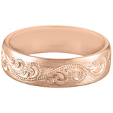 Man's rose gold wedding ring with paisley design
