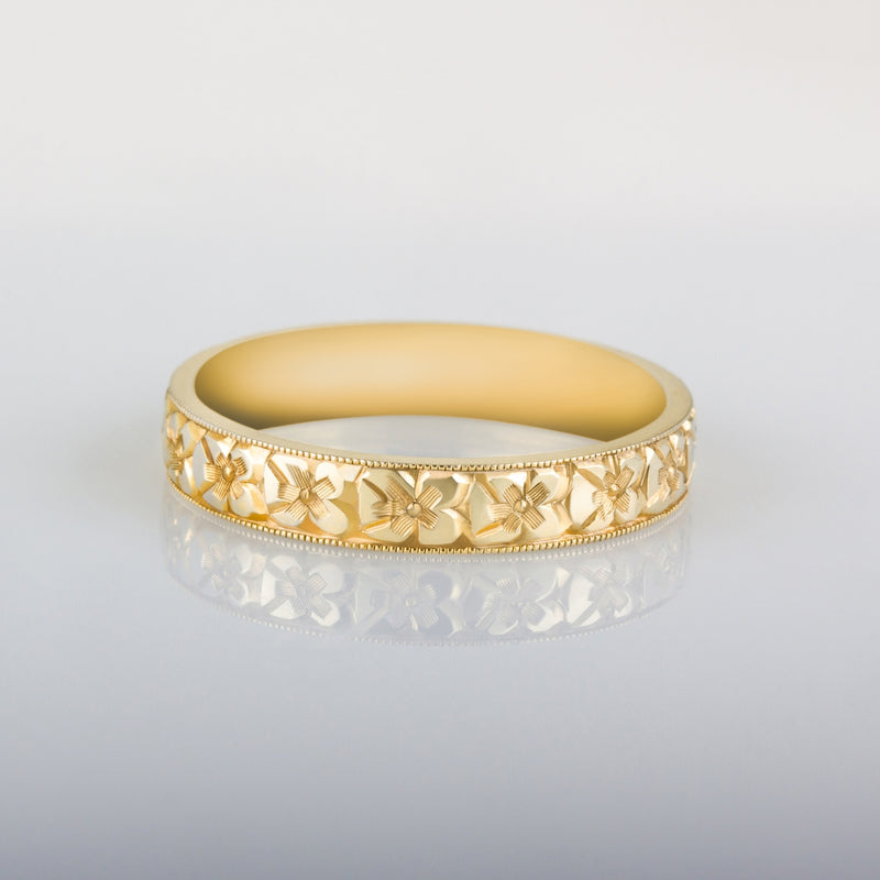 Orange blossom engraved wedding ring in yellow gold