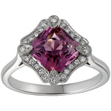 Pink sapphire halo ring with diamonds in platinum