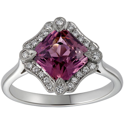 Pink sapphire halo ring with diamonds in platinum