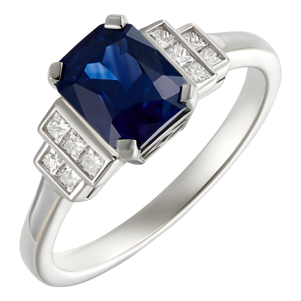 Platinum emerald-cut sapphire engagement ring with princess cut diamonds