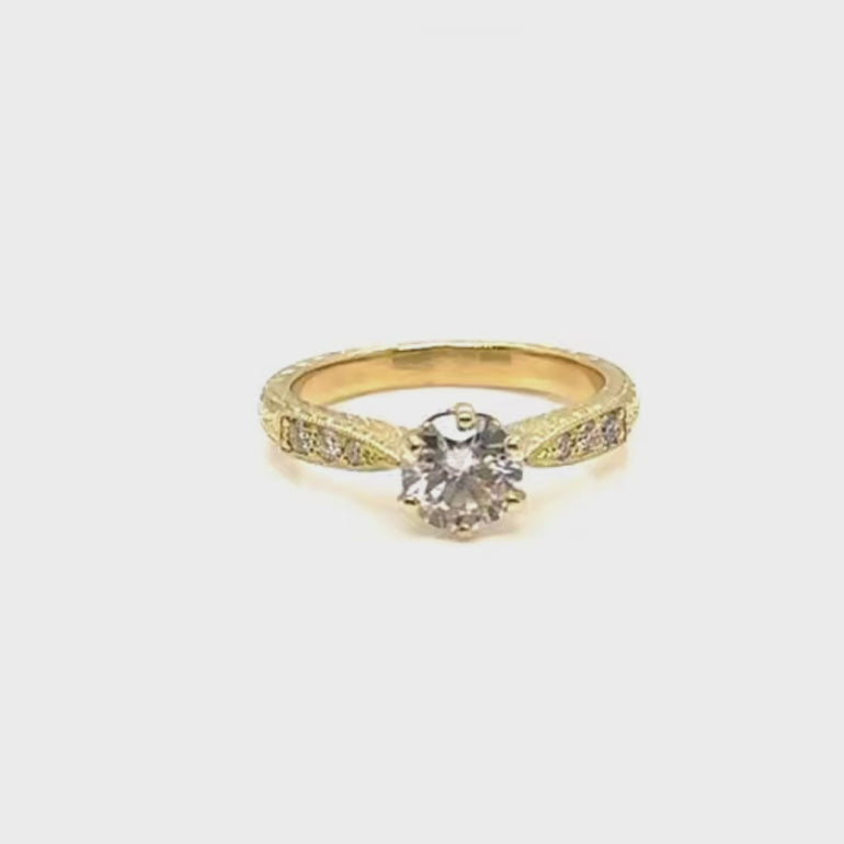 Round diamond engraved yellow gold engagement ring in vintage style