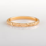 Rose gold engraved wedding band with paisley pattern