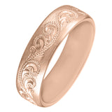 Rose gold men's wedding band with paisley pattern